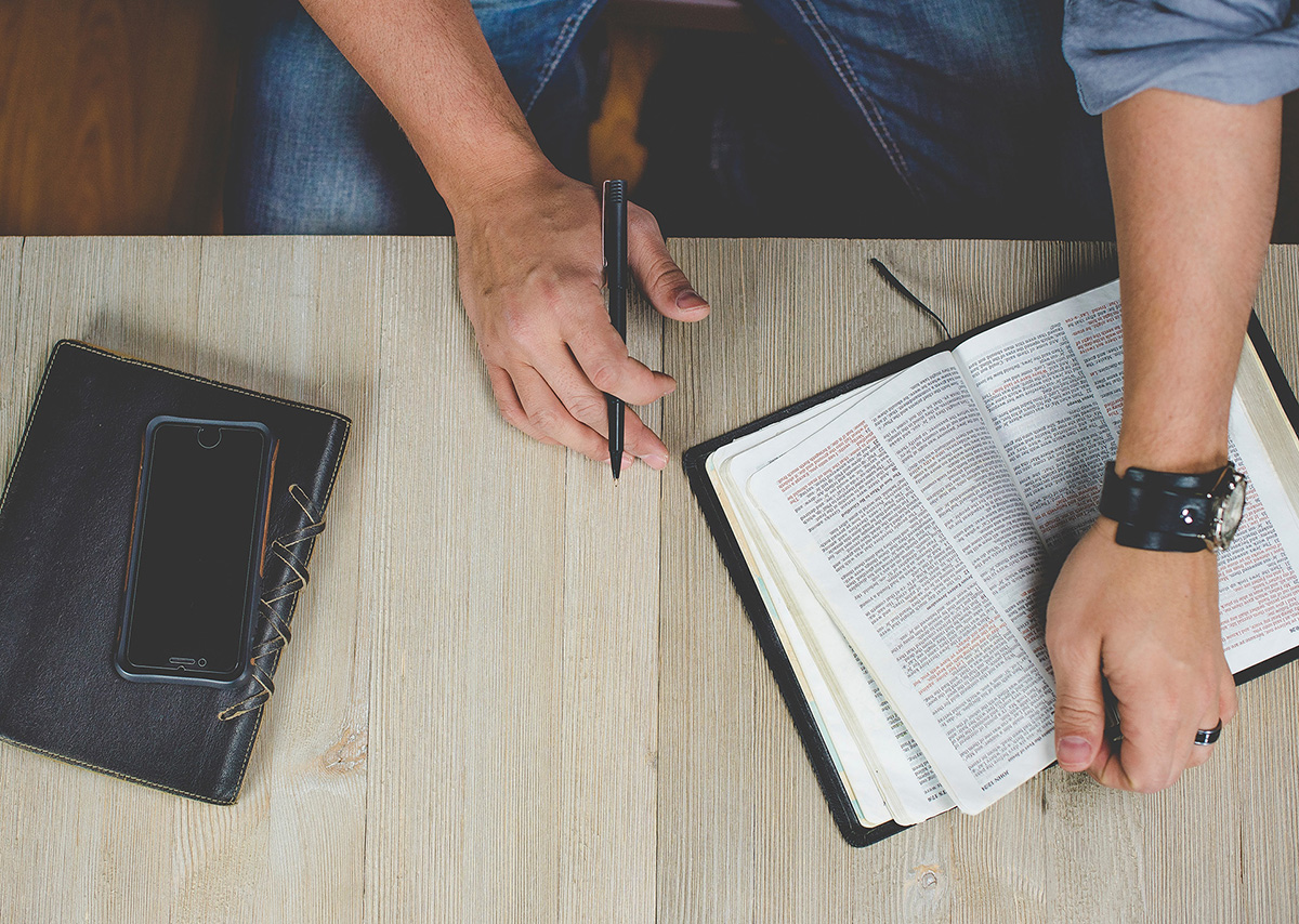 Man ready to journal while reading bible